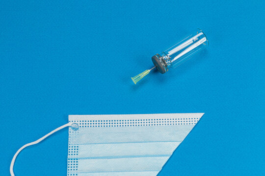 Blue background with surgical mask