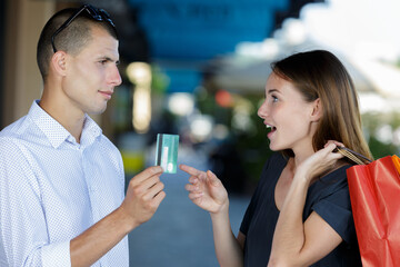 couple with shopping bags and credit card