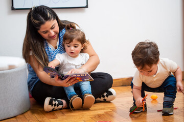 Female teacher teaching little students