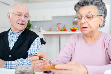 happy senior couple having breakfast