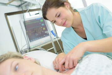 nurse tending to patients neck perfusion