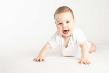 Fototapeta premium portrait of a smiling baby lying on his stomach