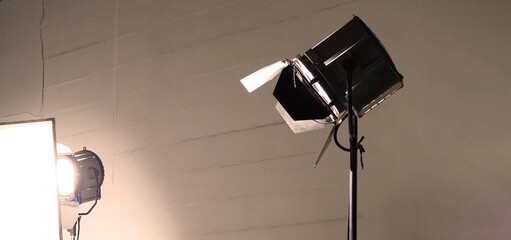 Studio light equipments for photo or film movie video. Light set for professional shooting and screen background. LED Flood light and Spot light for video production. Setup include Barn door softbox.