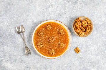 Traditional Azerbaijan,Indian,Turkish sweet dessert halva with walnuts on top.