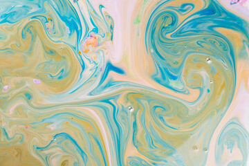 Fluid art blue yellow pattern. Abstract ink mixed texture. Psychedelic multicolored background