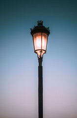 Fototapeta na wymiar old lamp on blue sky background