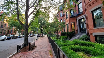 green street in a historic red town with cars, fences, red bricks (Marlborough street) © ZickZak