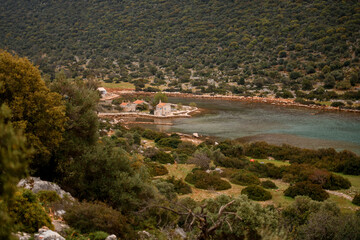 view from the hill to the bay and the island with stone houses