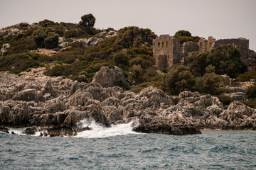 view to island with the ruins of the old building of ancient city