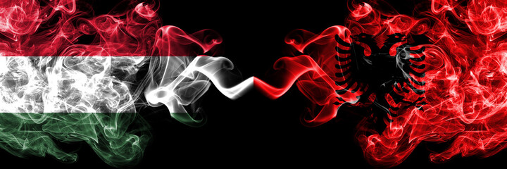 Hungary, Hungarian vs Albania, Albanian smoky flags side by side.
