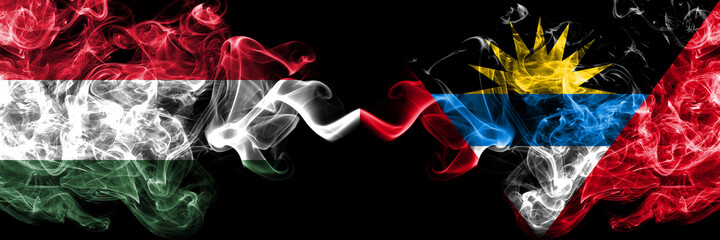 Hungary, Hungarian vs Antigua and Barbuda, Antiguan and Barbudan smoky flags side by side.
