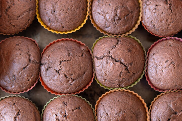 Ready-made chocolate muffins on a baking tray. Close-up. homemade baking