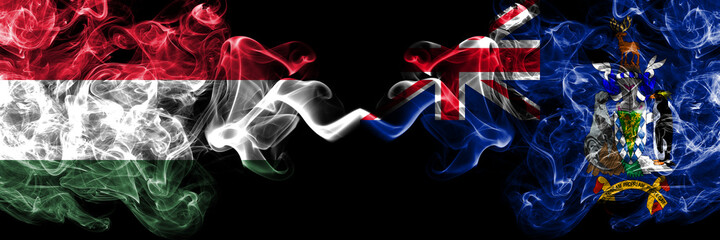 Hungary, Hungarian vs British, Britain, South Georgia and the South Sandwich Islands smoky flags side by side.