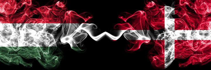 Hungary, Hungarian vs Denmark, Danish smoky flags side by side.