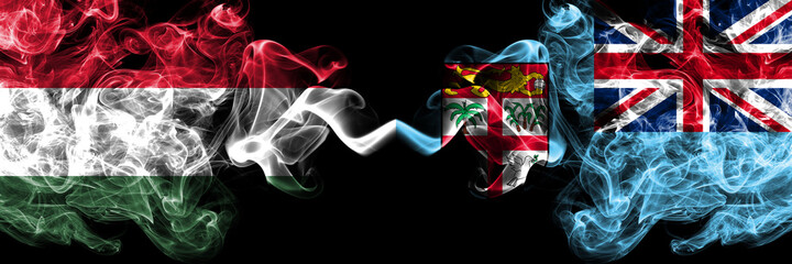 Hungary, Hungarian vs Fiji, Fijian smoky flags side by side.