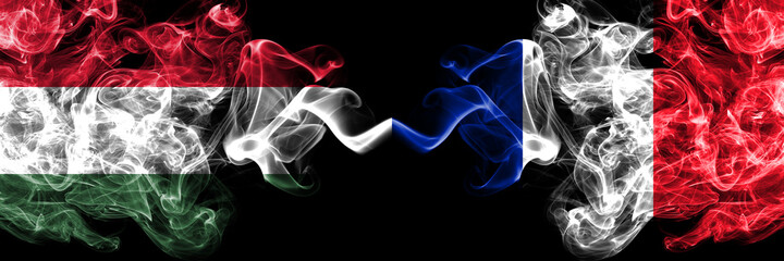 Hungary, Hungarian vs France, French smoky flags side by side.
