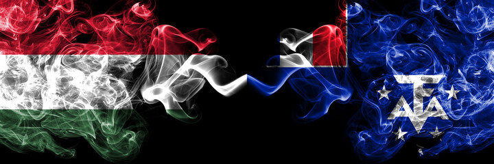 Hungary, Hungarian vs France, French Southern and Antarctic Lands smoky flags side by side.