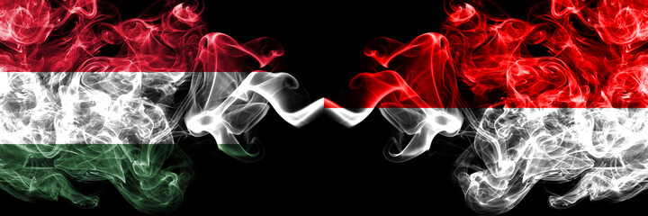Hungary, Hungarian vs Indonesia, Indonesian smoky flags side by side.
