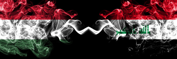 Hungary, Hungarian vs Iraq smoky flags side by side.