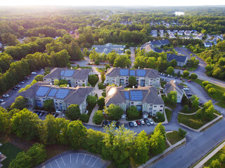 aerial view of apartment buildings with solar panel installed on roof  © nd700