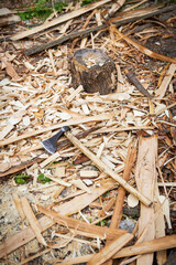 The ax lies on lumber, planed boards. Texture and background. Wood material for industrial construction.