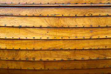 The wooden hull of a small boat