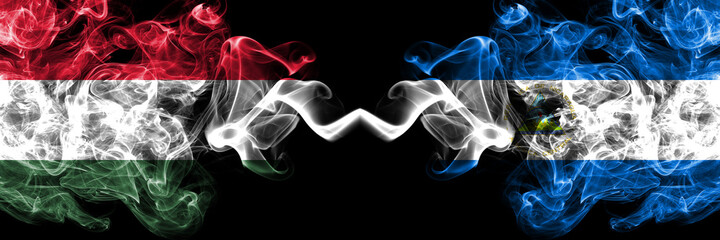 Hungary, Hungarian vs Nicaragua, Nicaraguan smoky flags side by side.