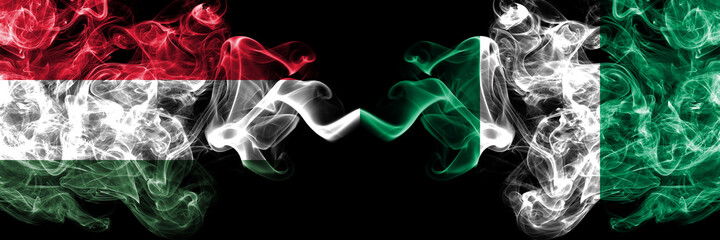 Hungary, Hungarian vs Nigeria, Nigerian smoky flags side by side.