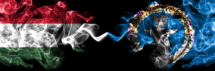 Hungary, Hungarian vs Northern Mariana Islands smoky flags side by side.