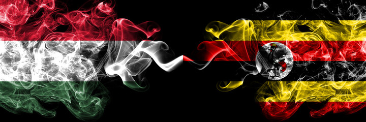 Hungary, Hungarian vs Uganda smoky flags side by side.