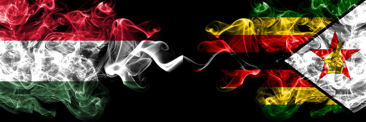 Hungary, Hungarian vs Zimbabwe, Zimbabwean, Zimbo smoky flags side by side.