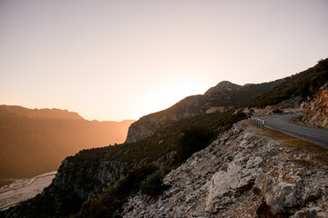 aerial view of mountains and clear sky lighted by sun rays