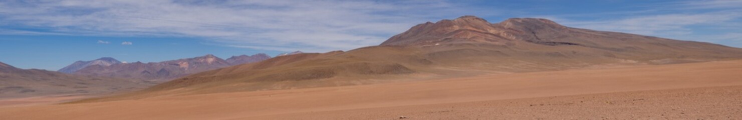 Huge panorama landscape in desert of brown and orange mountains in deserto de atacama, chile © José Rego