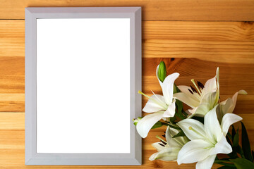 Frame with place for your text next to a bouquet of lilies