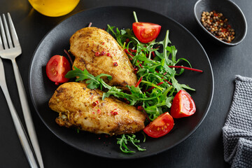Grilled chicken breast with vegetables and salad