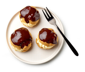 plate of freshly baked cream puffs