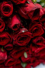 Engagement ring in red roses , gold ring with diamond