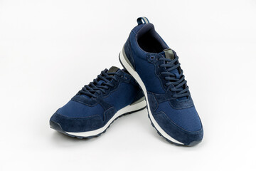 NEW BLUE, CASUAL, FASHIONABLE AND STYLISH PAIR OF SNEAKERS ON WHITE BACKGROUND. SPORTSWEAR, SHOPPING AND GIFTS CONCEPT.