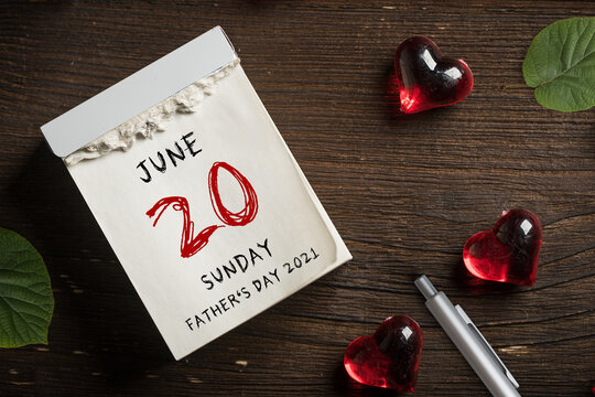 tear-off calendar with the date for the international Father's Day 2021 on wooden background