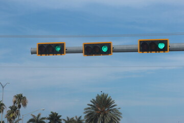 Stoplights on a nice day against the blue sky