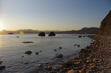 Fototapeta na wymiar Peaceful sunset or sunrise on the seashore landscape