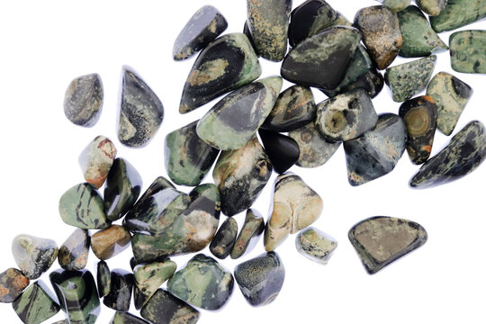 Kambaba jasper heap jewel stones texture on white light background