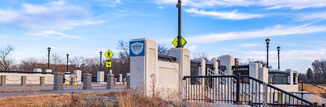 Concrete bridge with signs and streetlights panorama