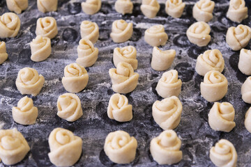 Buns ready to be loaded into the oven.