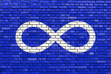 flag of Metis people painted on brick wall