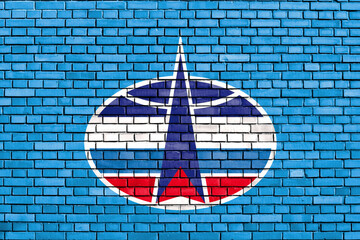 flag of Russian Space Forces painted on brick wall