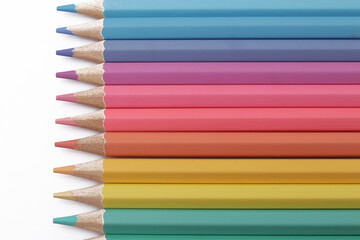 Close up of colorful colored pencils art education school supplies isolated on white