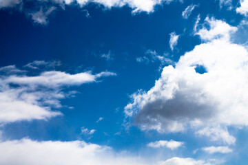 Naklejka na ściany i meble blue bright sky with cumulus clouds.