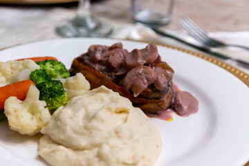 Close up to a fancy dinner plate in a event