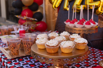Candy table at a party with sweet desserts